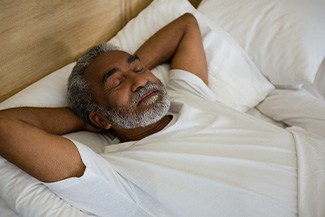 Man sleeping in a bed