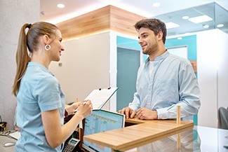 Man checking in at a dental office