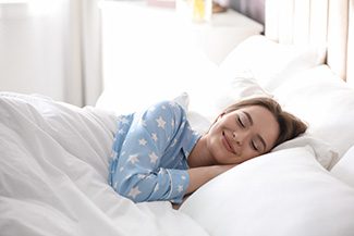 Woman sleeping peacefully on her side