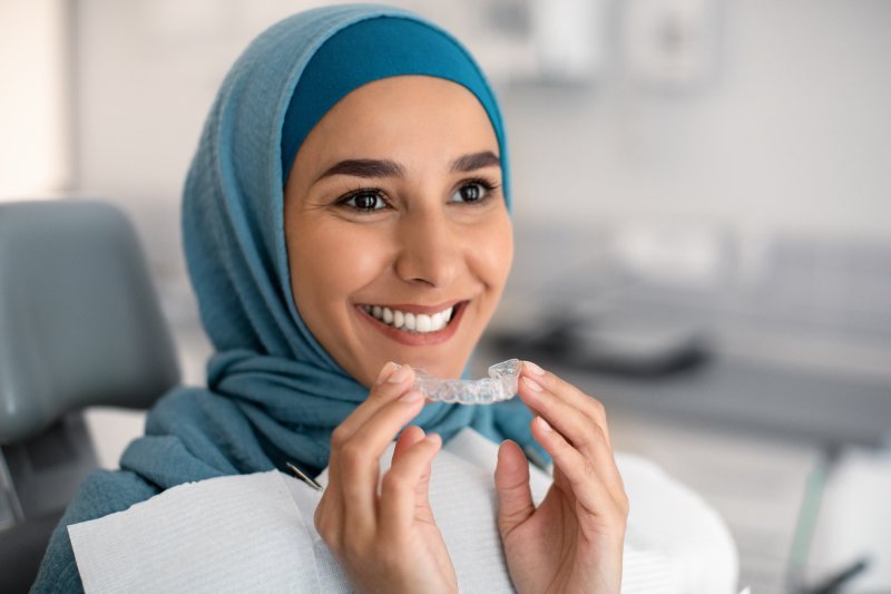 Patient smiling with Invisalign